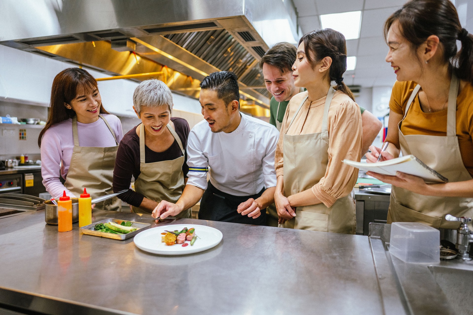 Crafting Culinary Masterpieces: Asian Chef Demonstrates Food Decoration to Students